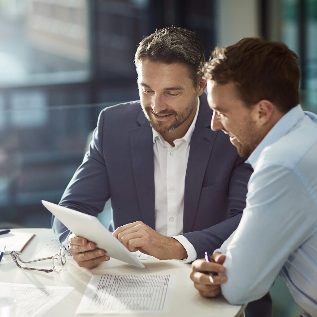 Cropped shot of two businessmen meeting in the office